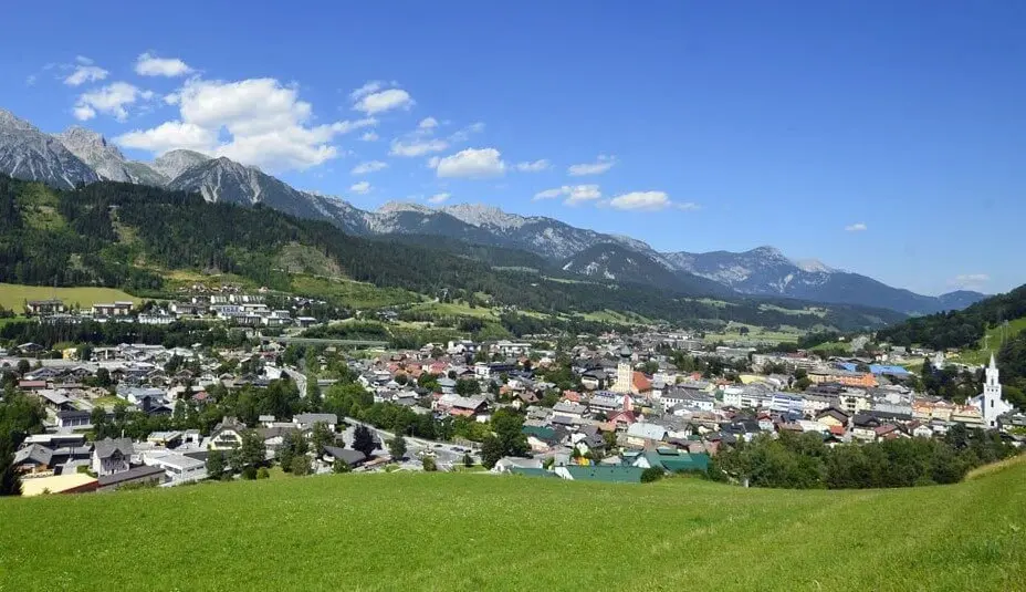 Salzburg Airport to Schladming private ski transfer Schladming town and church towers below the green Styrian Alps and Dachstein mountains