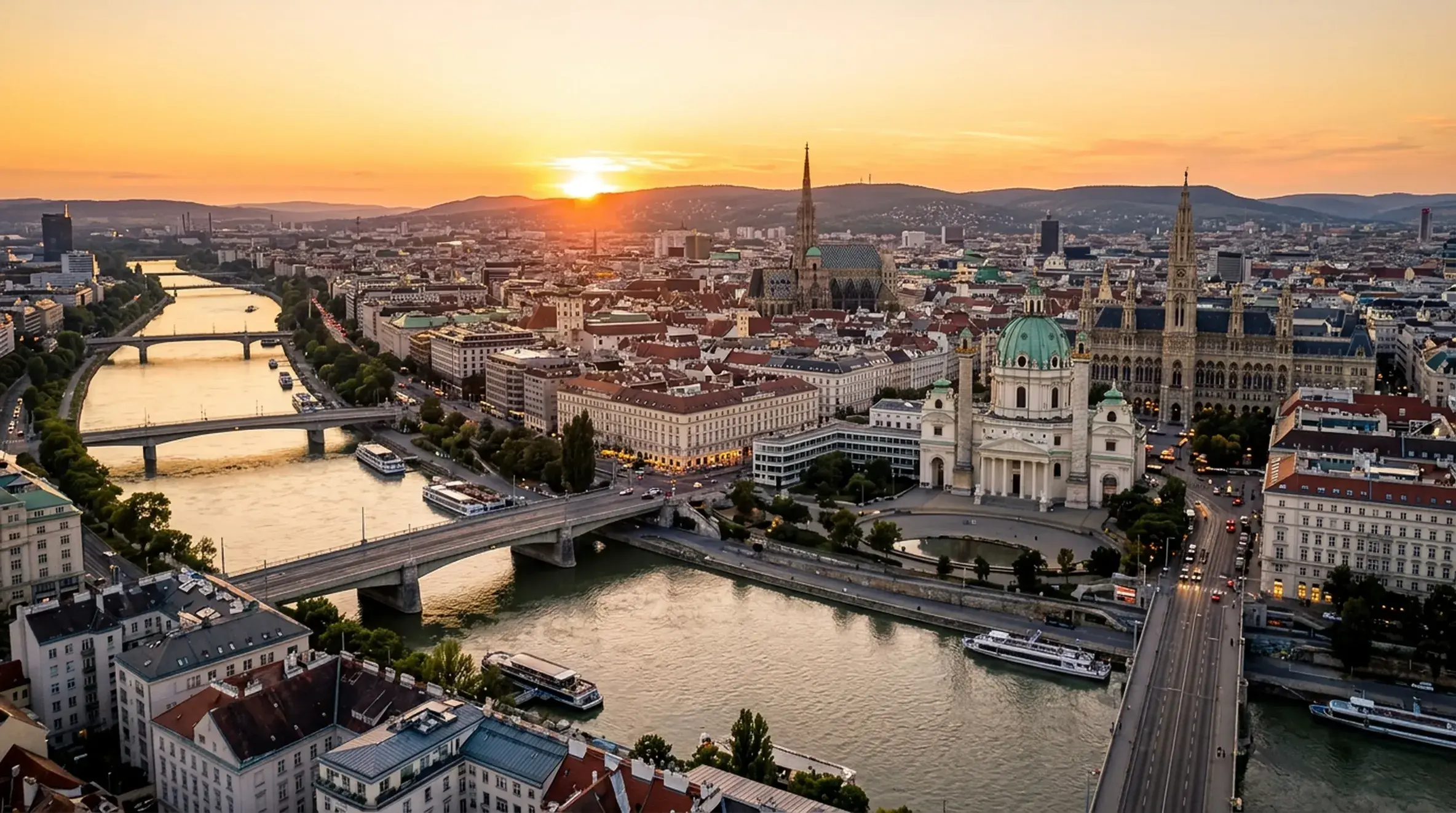 Private transfer from Salzburg Airport or Salzburg city to Vienna Aerial sunset panorama of central Vienna with the historic skyline, St Stephen's Cathedral and the Danube Canal